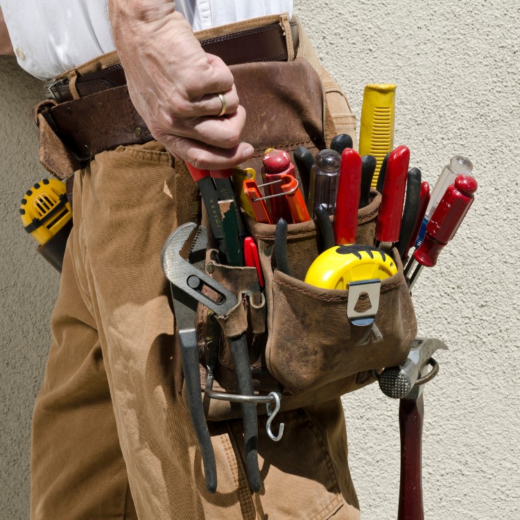 Hand tools arranged on a workbench